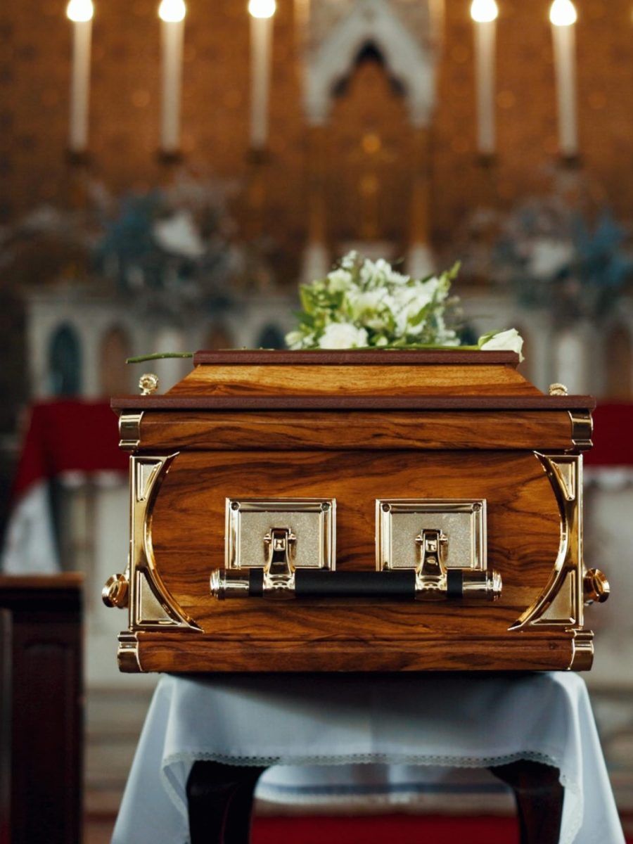 Coffin, church and funeral service in closeup, memorial and event to celebrate life, worship and fa.