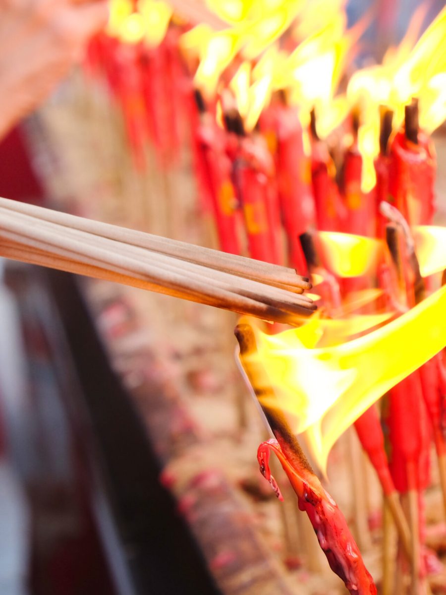 people-light-the-candle-at-chinese-temple-2024-02-10-00-10-06-utc